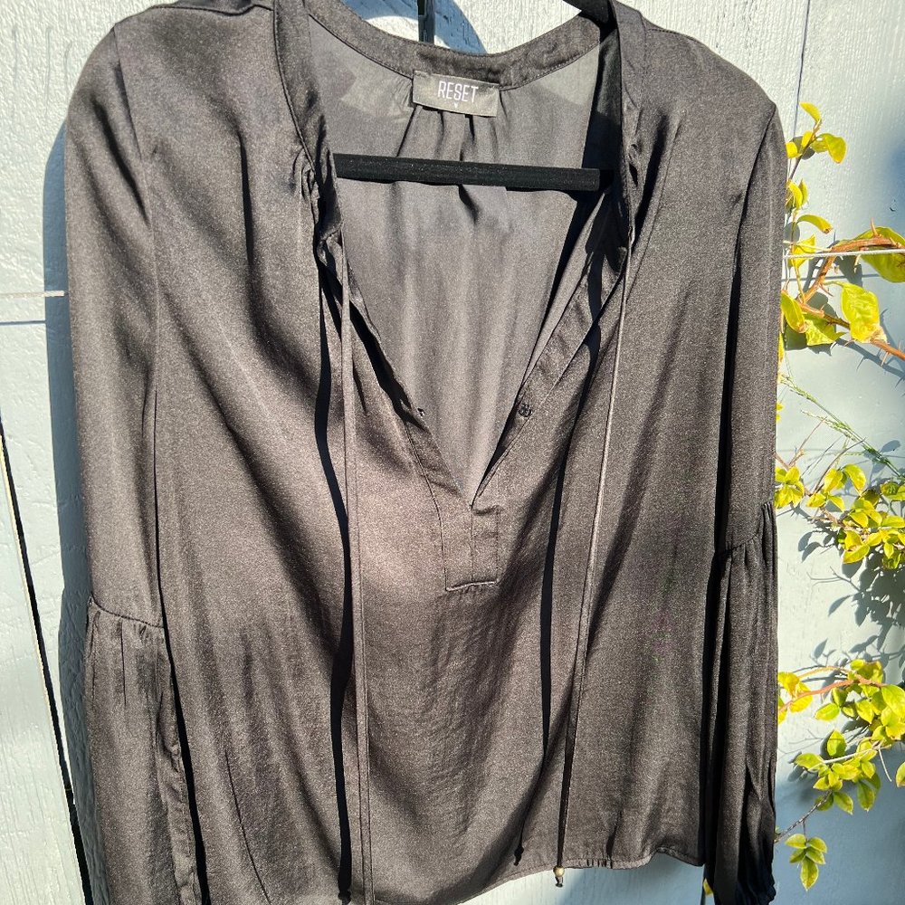 The Reset Black Satin popover